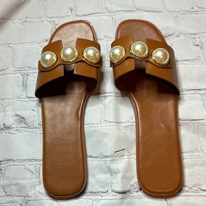 Brand new tan slides. Size 43. Fits 10- 10 1/2